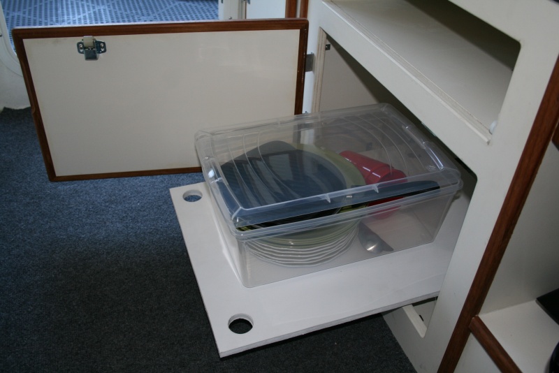 Extending shelf below aft dinette seat cabinet.