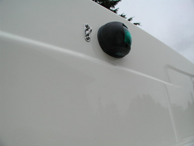 Eye pad for forward fender, reachable from cabin window.  No more trips forward for the mate.