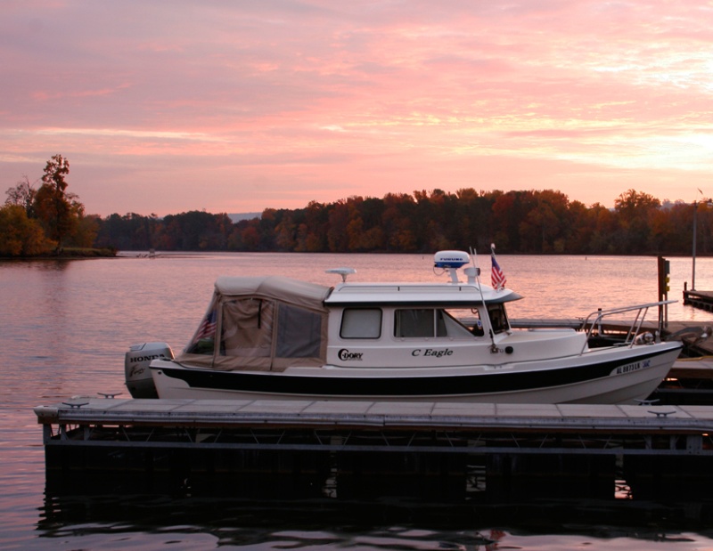 Fall Sunrise at Goosepond Marina features vivid pink hues.