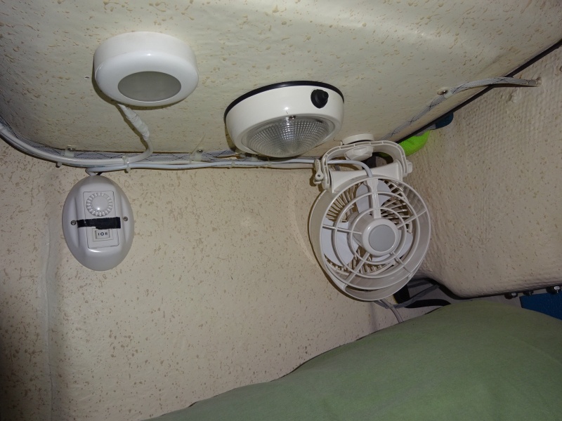 Fans in my corner, light in the middle, red or white, and remote control.  All LED lighting on the boat.  Black tape to subdue the "blue night light" on the remote.