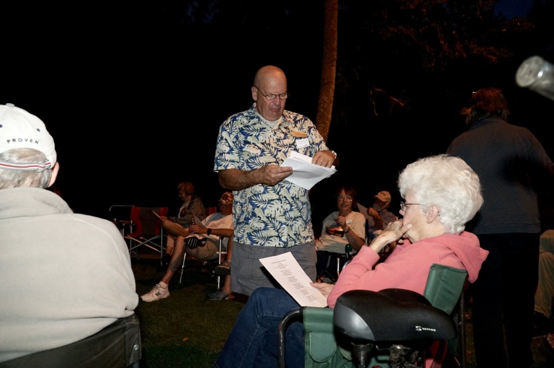 Fearless Leader Tom hands out the song sheets.  New lyrics of old songs--all about C Dorys--and built for two...!