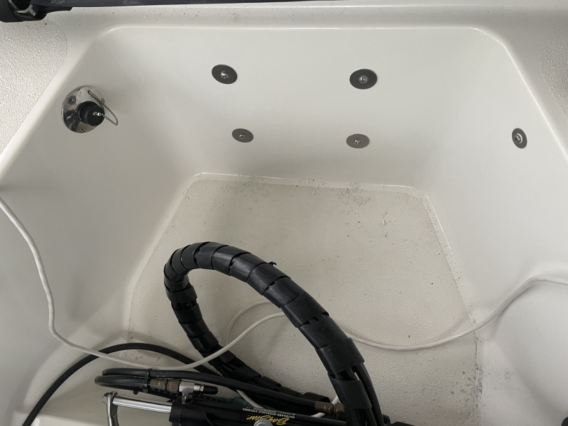 fender washers on the backside hold mounting bolt heads in the motor well