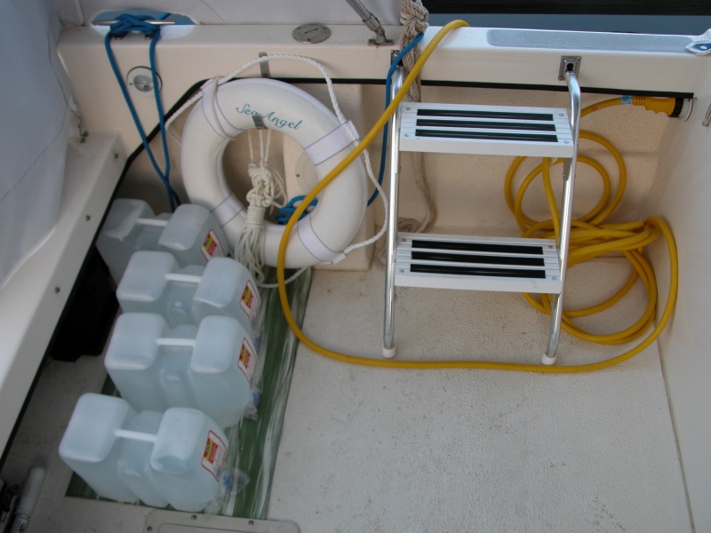 First morning on Sea Angel and deck inventory messy, but there. Full water tank, 4ea. 2 1/2 gal water jugs & 2 cases on the V-Berth; that should be enough weight to keep the water line, and bow down.
Thu 01 Jun 2006 06:19:16 AM CDT