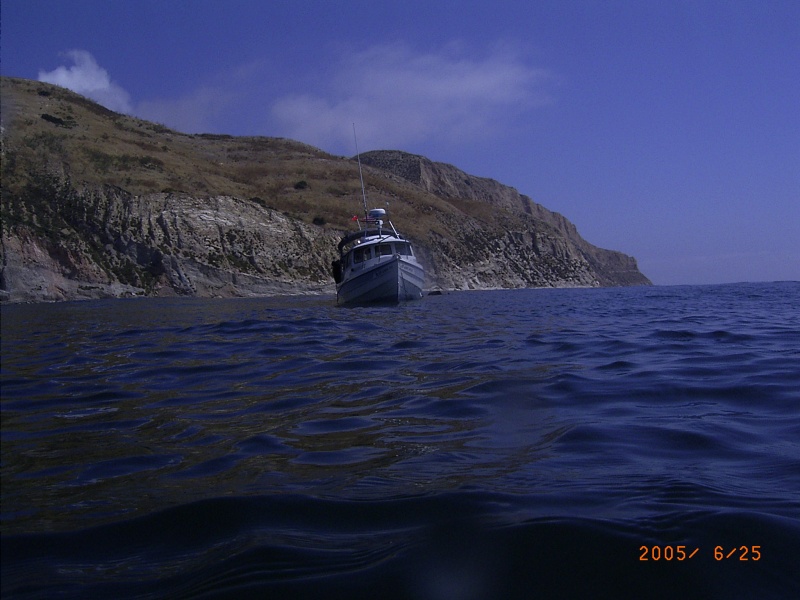 Fishtales at anchor near sandstone cliffs of Santa Cruz Island