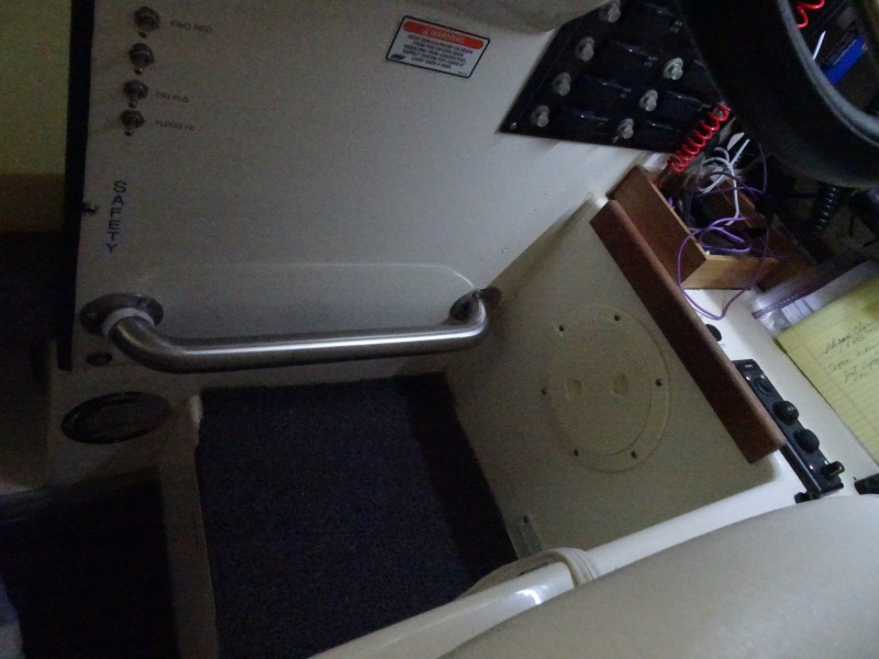 foot rest for helmsman. several bamboo boxes for commonly used tools and navigation instruments.  To the right is the on/off for rear view, the windshield wiper delay system.