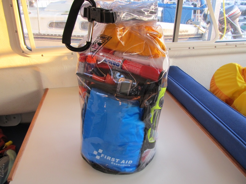 fully stocked ditch bag lives at my feet at the helm
