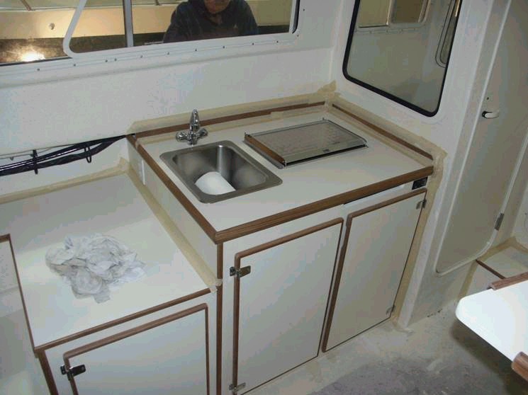 Galley area, no changes but Wallas unit is now installed (making progress). We are excited and anxious to get this rascal ready to launch.  More to come and thanks for viewing. 3/15/04