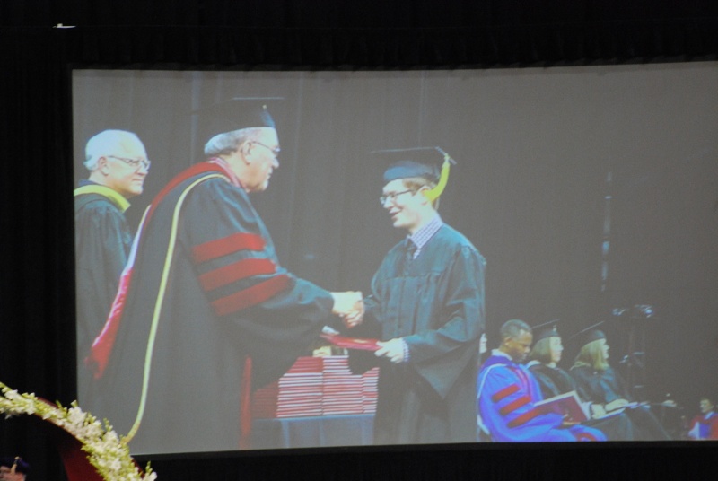 Getting that paper handed to him.