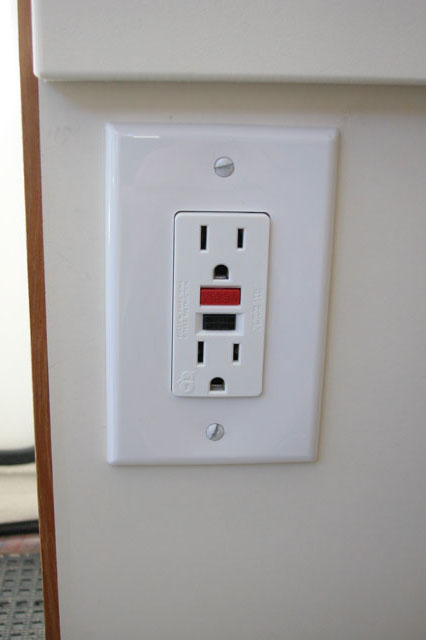 GFI outlet mounted on front of the port aft seat