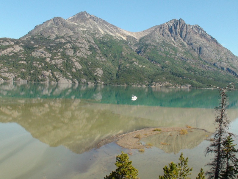 Glacier river silt blending into Atlin Lake