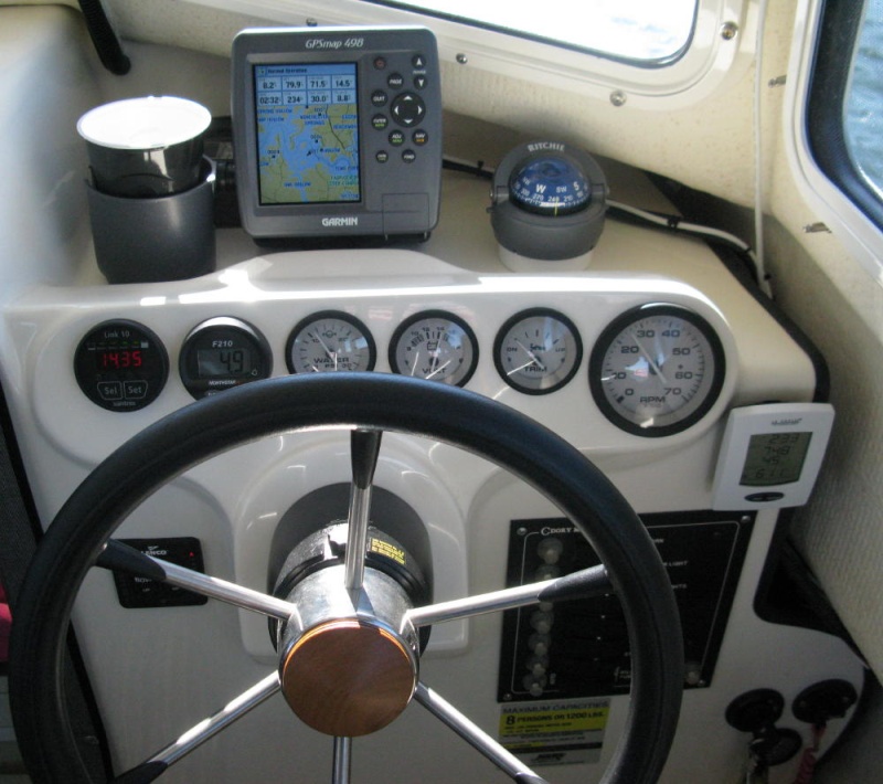 helm - Garmin 498, Ritchie Explorer compass, Xantrex Link 10 house battery monitor, Northstar fuel flow meter, water pressure, volts, trim, tachometer, indoor-outdoor thermometer, Lenco trim tab controller