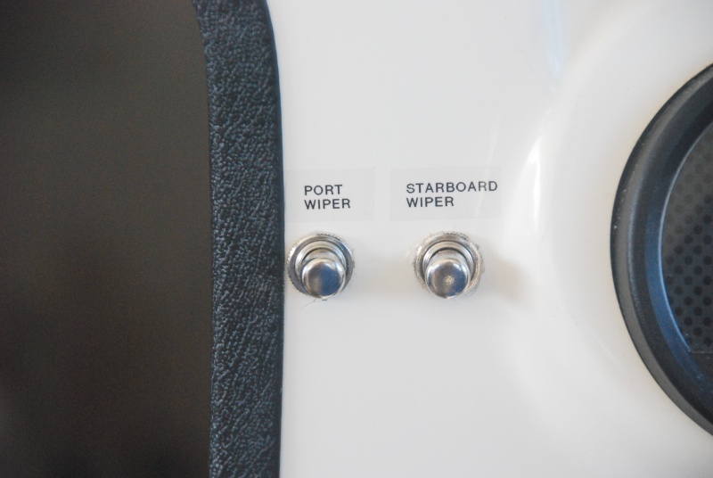 Helm wiper momentary control switches labeled.