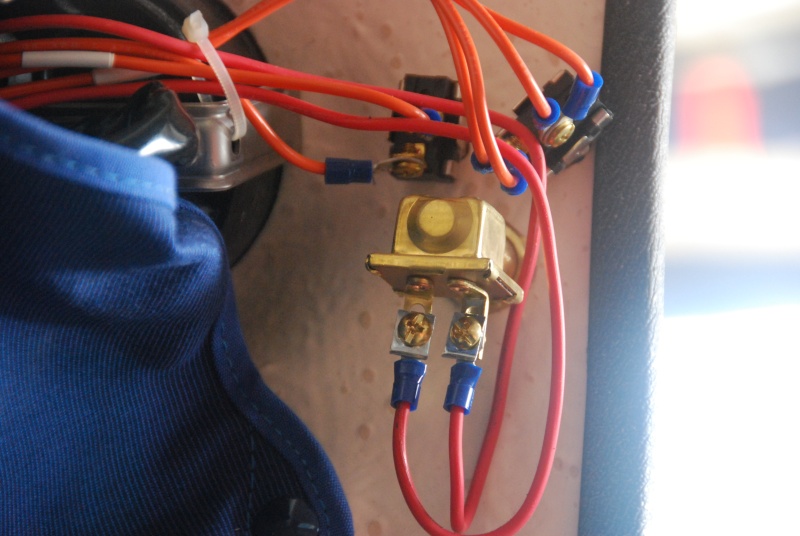 Helm Wiper Motor/Washer Switches.

 The added Washer Switch is the larger bottom switch. An in-line fuse holder is located abt 2" from HOUSE 12V BUSS feeding the Washer Switch.