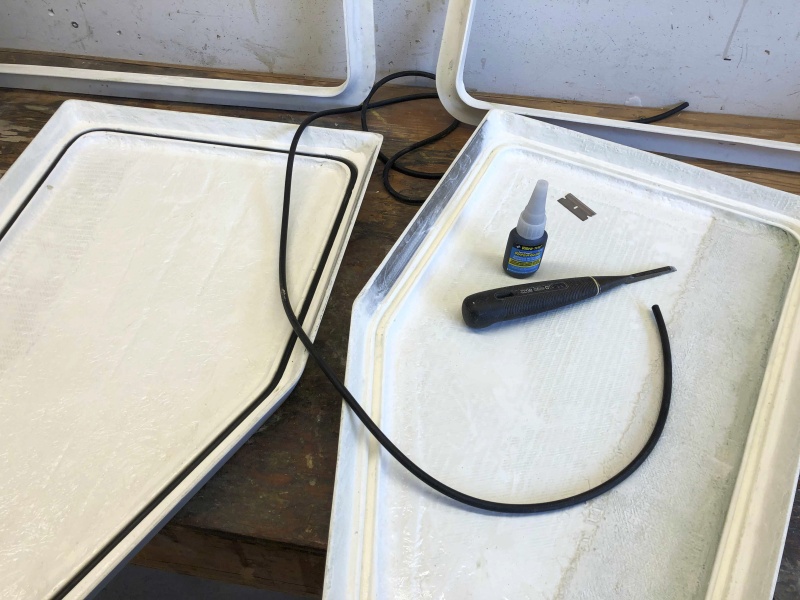 Here the o-ring material is being inserted (friction fit) into the channel. The o-ring material is .250" Buna-N 70 O-Ring Cord Stock, from theoringstore.com. The glue is Vibra-Tite 388 Super Glue (specifically for gluing rubber) from Amazon. I used the chisel to make clean out the channel and ensure it was fit to hold the o-ring. The reinforced area (extra later of fiberglass) alongside the long side of the lid is where two latches will be installed. Next up - build the lockers!