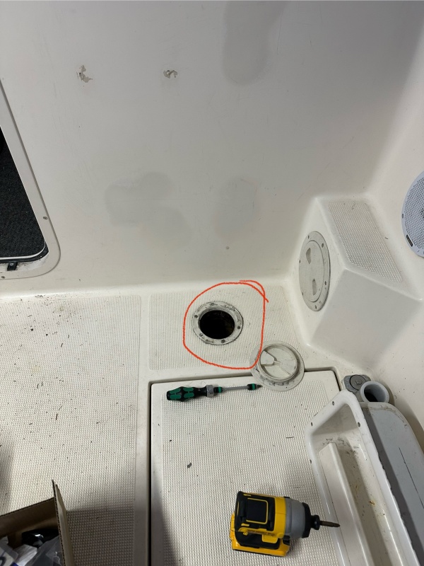Hole in cockpit deck improperly sealed.