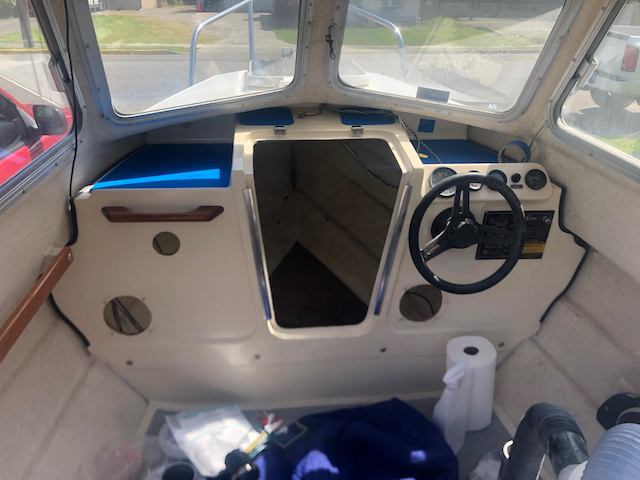 Holes cut for new speakers, new radio and USB port. Also changed the wiring ports behind the controls on the starboard side.