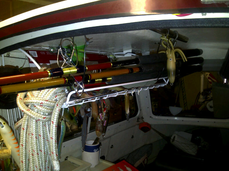 Home Depot shelf hangs jigs & rods above table