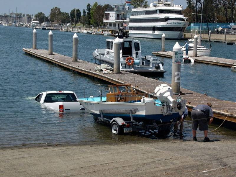 "Honey, sorry you nodded off, How far do I have to drive in to get the boat to float off?"

or "Honey, I stopped here cuz I didn't want to get the trailer lights
all full of salt water."
ADD YOUR CAPTION BELOW