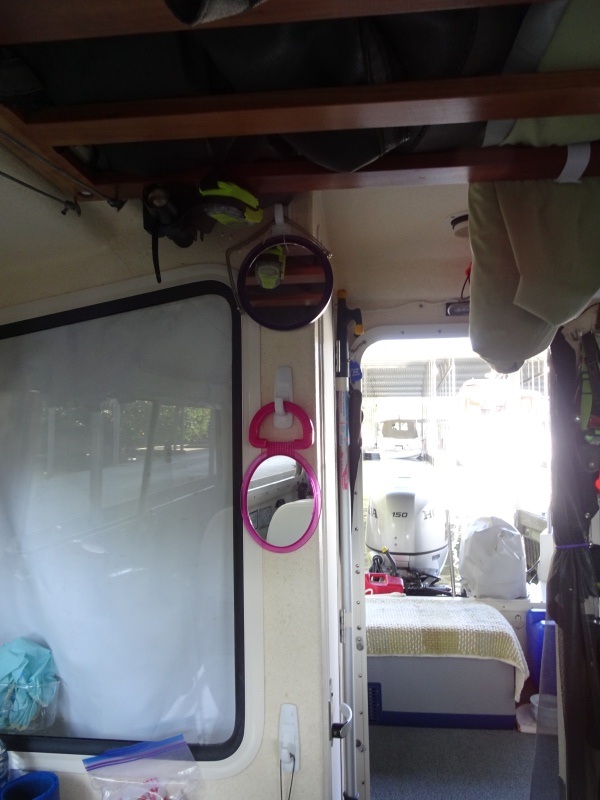 Hooks for towels, mirrors, fly swatter?? Also there is an emergency flash light and the PLB right above the upper mirror.  These are in "Grab and go" mounts.