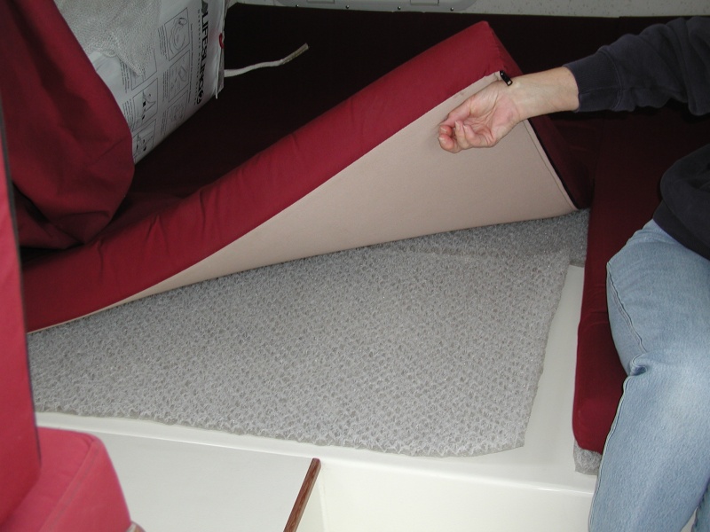 Hyper-Vent installed under bunk to prevent condensation. Available at Fisheries Supply. Note mattress and Hyper-Vent has been split apart 22"  at center seam to ease opening of hatches.