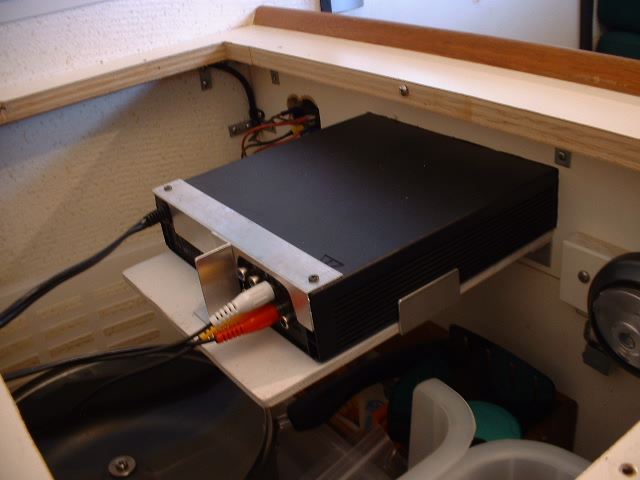 I built this bracket from 1/4" plywood and angle aluminum.  It is hooked into the aux jack of our stereo system. Great sound!