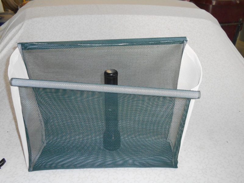 I credit my wife for introducing me to a fabric called "vinyl bag mesh". It is all plastic, mildew proof, machine washable, easily sewn, doesn't ravel, and is available in many colors.  The green matches my boat perfectly.