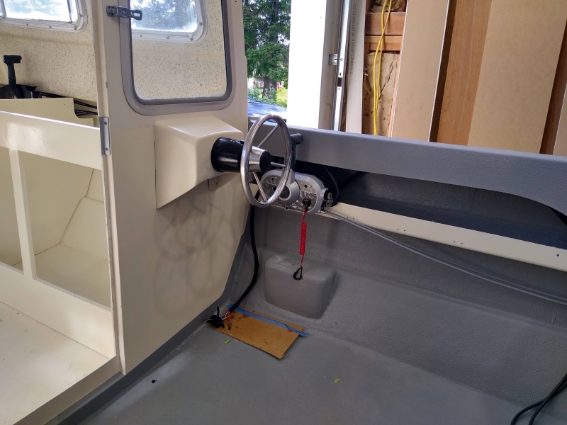 I do a lot of trolling for Salmon, I needed steering and throttle on the deck. I built the helm mount by modifying one I had on hand from a Livingston. Steering is a Baystar system, Mercury Shift Throttle control. I love the set up. 10? Garmin plotter / Sonar not show.