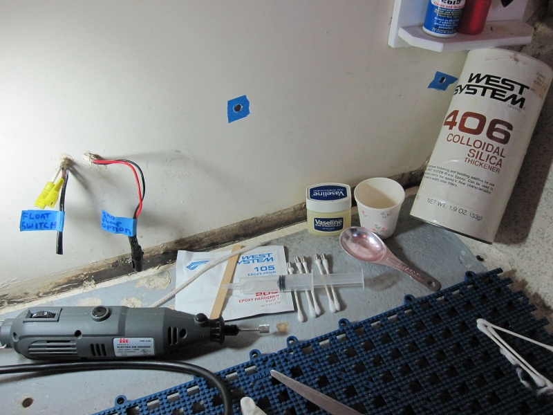I filled the cavities about 2/3 full with thickened epoxy(after wetting out). Q-tips were cut in half and used to locate the inserts into this mixture.  The Vasoline was intended to keep the threads from getting fouled with epoxy. I never used it. The blue tape makes removing overflow easy. Nice and Clean!