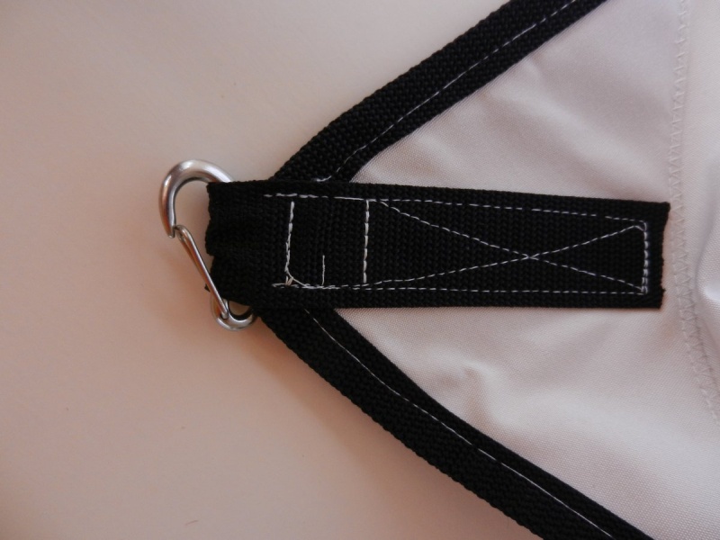 I need a better clip mechanism for the three eyenuts, but this works for now.  The other corners and the center tab towards the bow just have short lengths of small line.