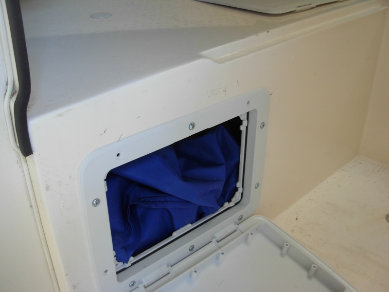 I removed the water tank from under the dinette seat and replaced it with a fabric "bag" tank under the port V berth.  Water suppy is from the same filler cap, but now a longer hose runs along the side of the hull, thru the front dinette seat to the tank location.  From there a smaller line goes to the foot pump.  Later edit=, bag leaked so went with a smaller hard tank of about 12 gallons.