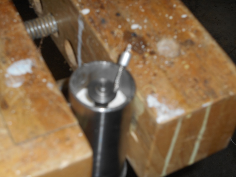 I store the expansion pin, when not in use, in a 1/4" hole drilled into a Starboard plug glued into the top of the lower mast.