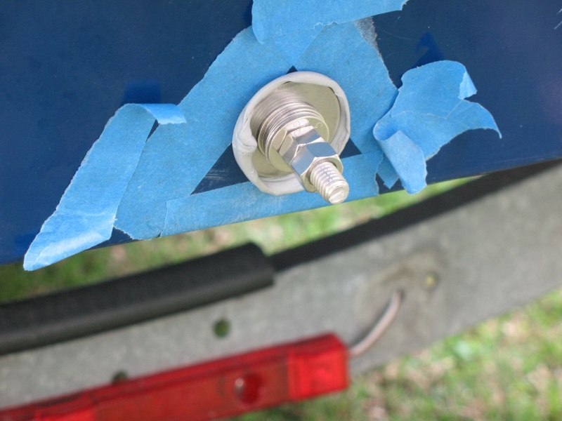 I temporarily moved on to another task because rain was in the forecast.  I didn't want water to get into the core, so I used butyl tape and some large fender washers to make a tightenable plug.