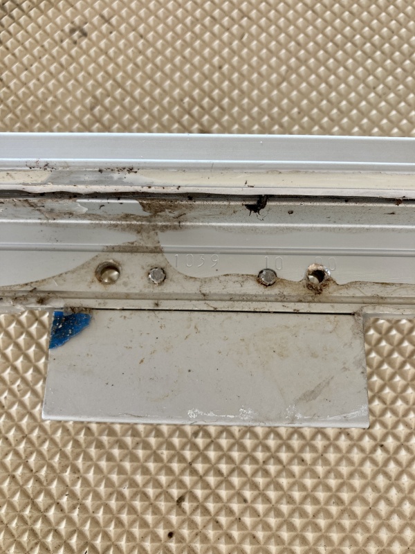 I think the reason it never sealed correctly (I'm guessing from the factory ) is that the machine screws that hold the hinges stick out about 1/32 -1/16.
When the hatch was tightened down the screws left a mark on the gel coat and stopped the hatch from fully compressing the caulk right underneath the hinges.