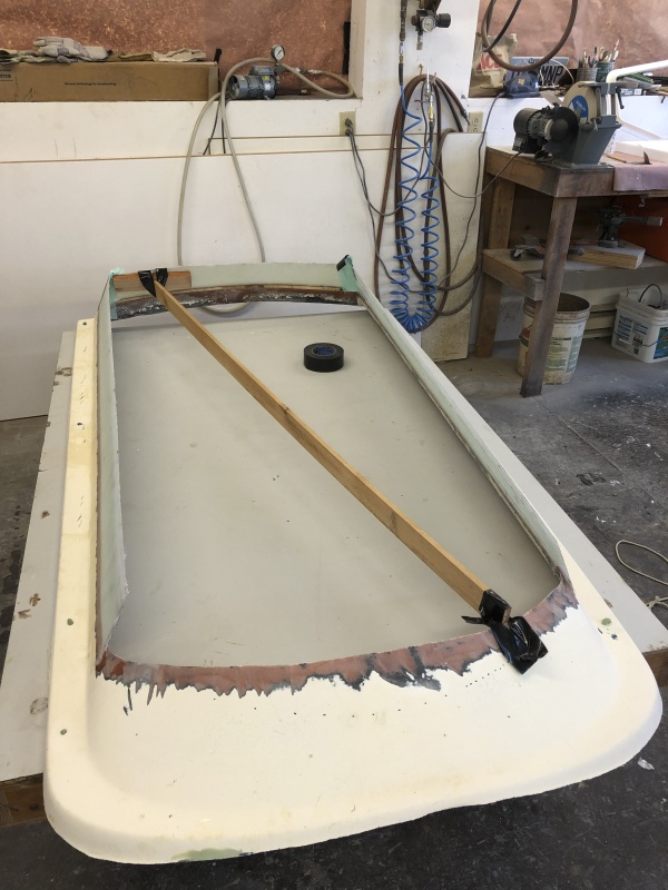 I used smooth 1/4" masonite to make forms (forgot to take pictures) for the new sidewalls and applied one intial layer of 1708 fiberglass ioregnated with West System 105 epoxy.