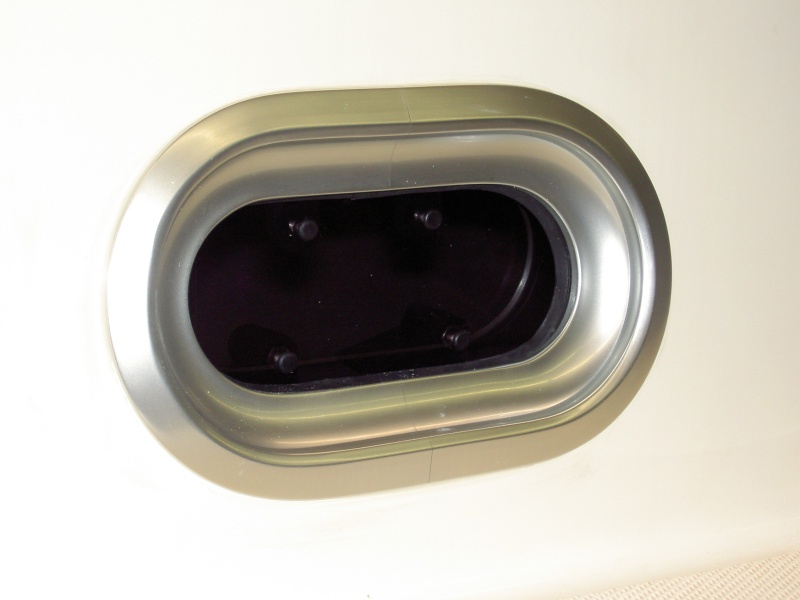 Insert porhole after caulking and secure from inside.