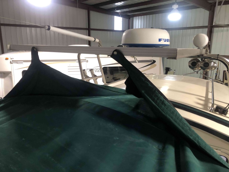 Installed snaps to solar panel to hold bimini back for easy entry to boat when docked. 1
