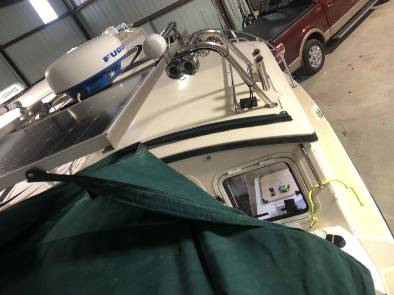 Installed snaps to solar panel to hold bimini back for easy entry to boat when docked. 2