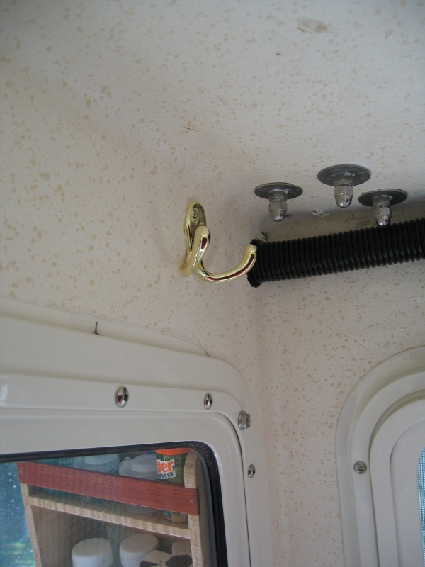 Installed two double brass robe hooks in head/shower for hanging up raingear etc.