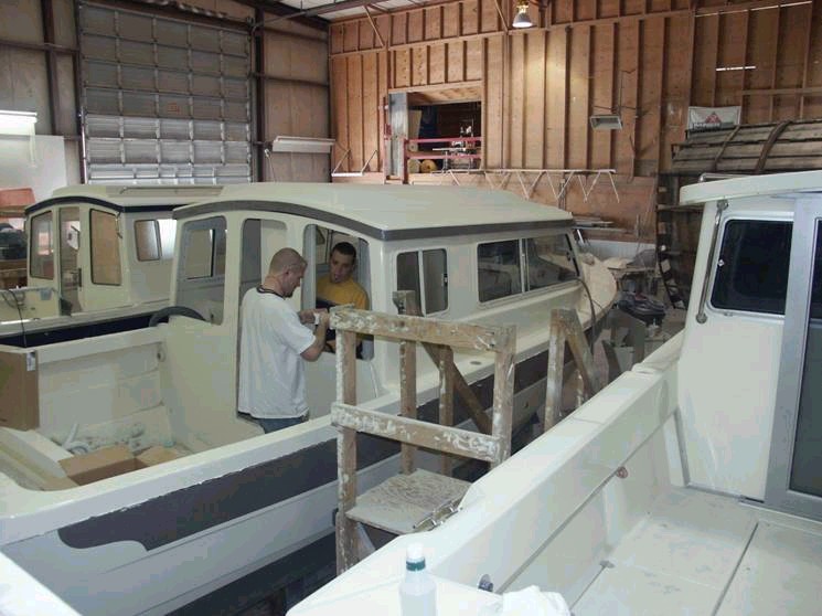 Installing rear window (Starboard side view).  No rails or door yet. 3/8/04