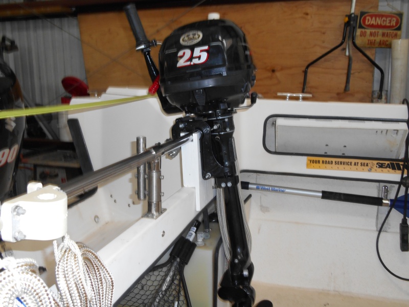 It slips in, without fasteners, and is left at home with the dinghy and motor when they aren't to be used.