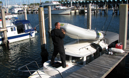 Jeff dumping water out of the dinghy