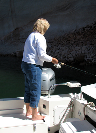 Joan fishing on the Escalante River