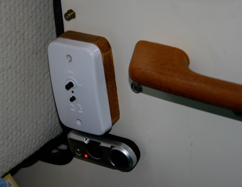 Kenwood-Remote-Control is velcro mounted under the Shakespeare Skywatch TV amplifier box on the forward port bulkhead.