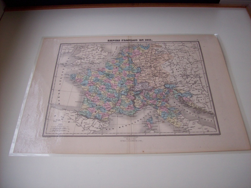 Laminated antique map of France from the height of Napoleon's reign.  Printed in 1872 depicting France in 1811.  I also had a custom piece of glass cut to fit inside the table fiddles to protect the map.