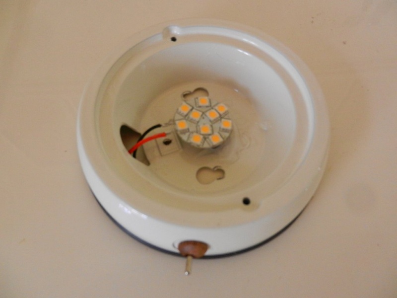 LED "puck" glued to old housing, wires and new switch installed
