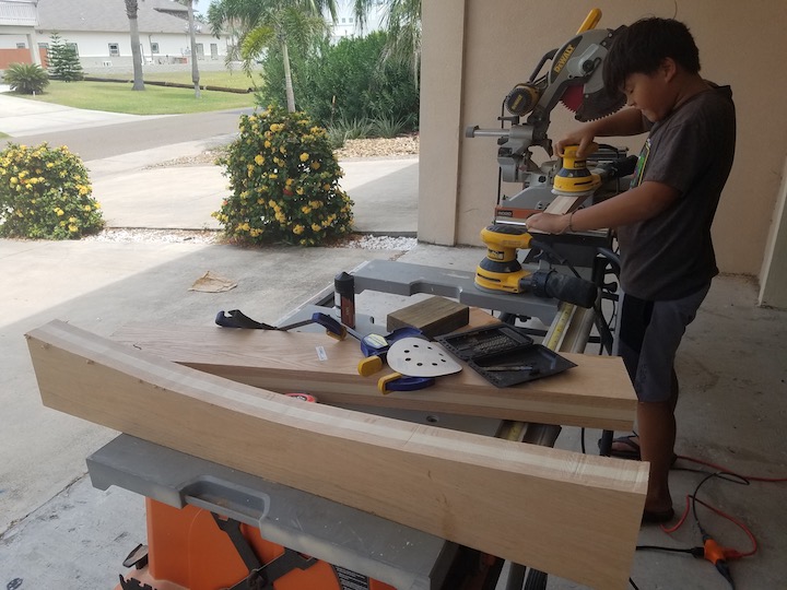 "little man" practices using the orbital on the piece cut off to match the curve of the roof