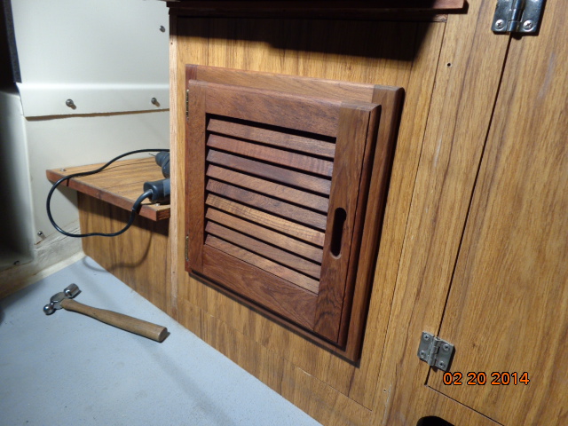 Louvered door installed in the storage area under the helm seat. Finally done with these doors!