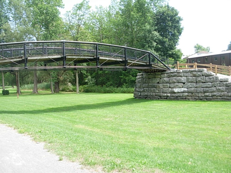 "Low bridge, everybody down" is the song we've all learned in grammer school.  This is one of the early bridges sold to a farmer when the barge canal was built. A flood damaged it and it was then salvaged by volunteers.  It was rebuilt to display the first iron bridge in the world.  Note the rocks on the abutment.  It was built by heavy equipment by the volunteers.  It does not have near the workmanship quality of the old hand done stone work.