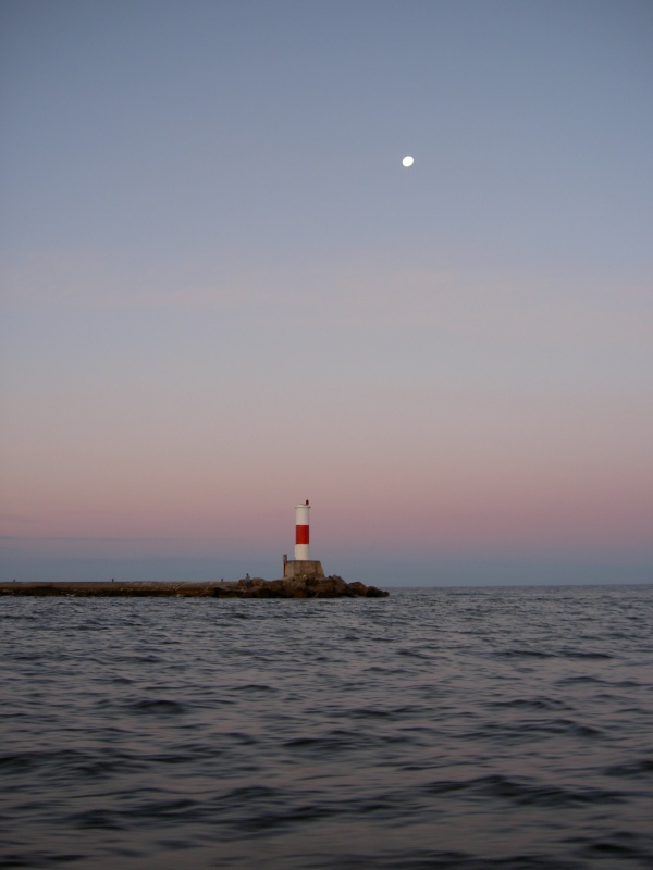 Manistee Light / Lake MI at dawn.  Taken while heading out for salmon on Not For Hire.