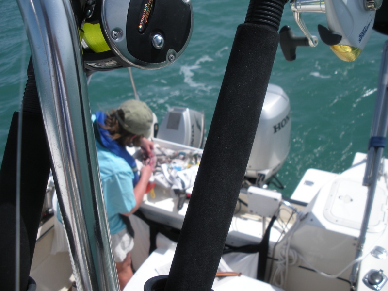 Marcia preparing bait and tackle.